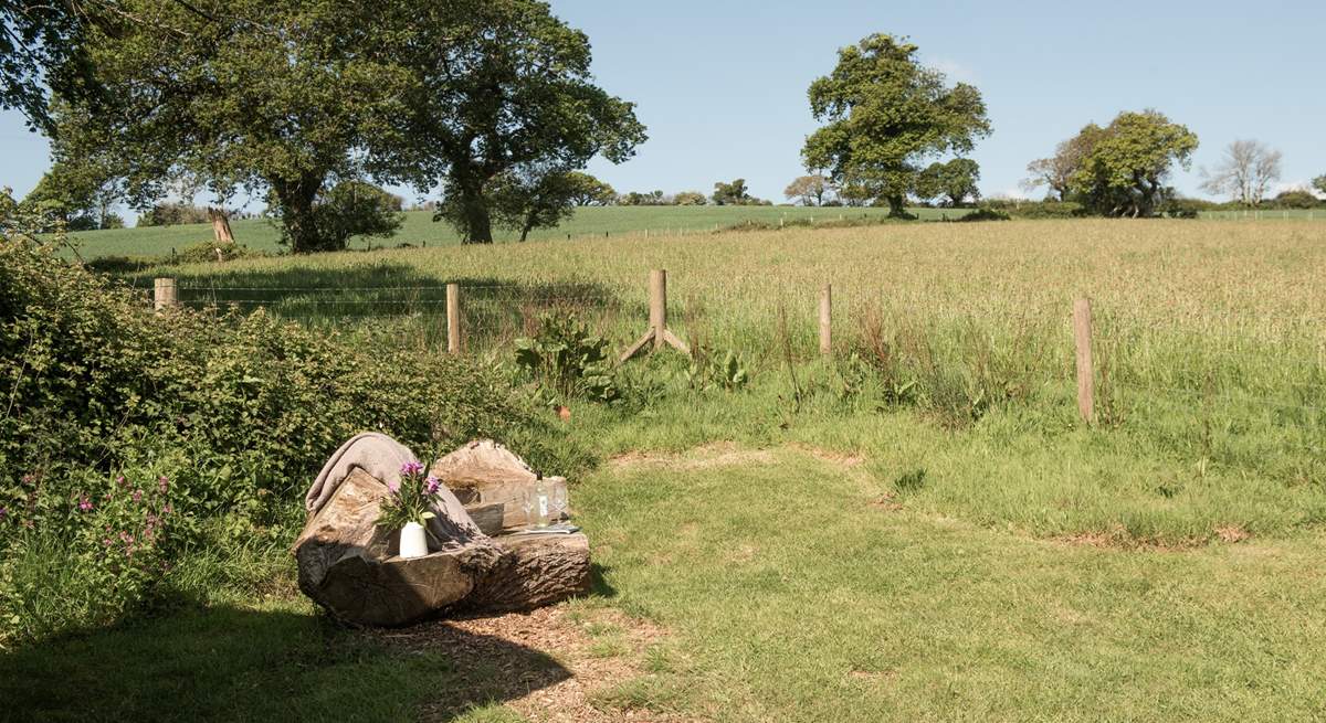 The hand-carved seat is idyllic for whiling away the hours with a good book. 
