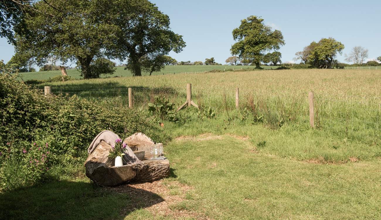 The hand-carved seat is idyllic for whiling away the hours with a good book. 