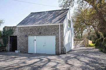 The back of Little Hawkridge is the parking area for Hawkridge House and your footpath runs along the right-hand side.