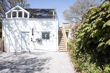 The private parking for two cars and electric car charging point for guests at Little Hawkridge.