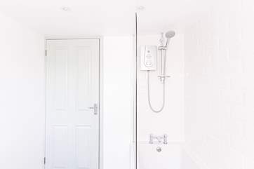 The beautiful white tiles give the space a light and airy feel.