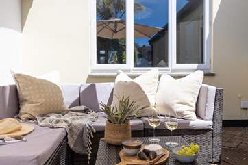 Treat yourself to a glass of something special in the comfy outdoor seating area.