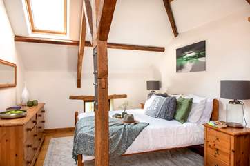 The A frames and beams add to the overall charm (please note there is no door to this bedroom from the stairs).