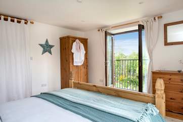 The room also has a Juliet balcony overlooking the neighbour's glorious garden.