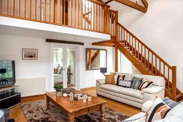 Stairs lead up from the sitting-area to the twin bedrooms and double doors lead to the ground floor bedroom.