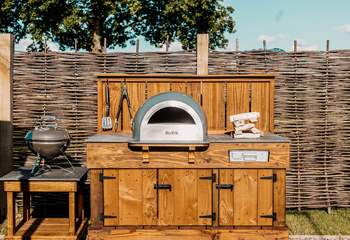 Outdoor cooking is taken to a whole new level here with a fantastic pizza oven and a barbecue.