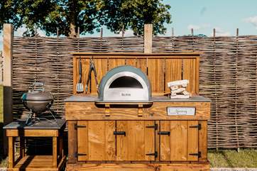 Outdoor cooking is taken to a whole new level here with a fantastic pizza oven and a barbecue.