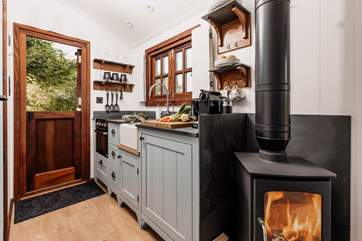 The wood-burner will keep you cosy during cooler months.