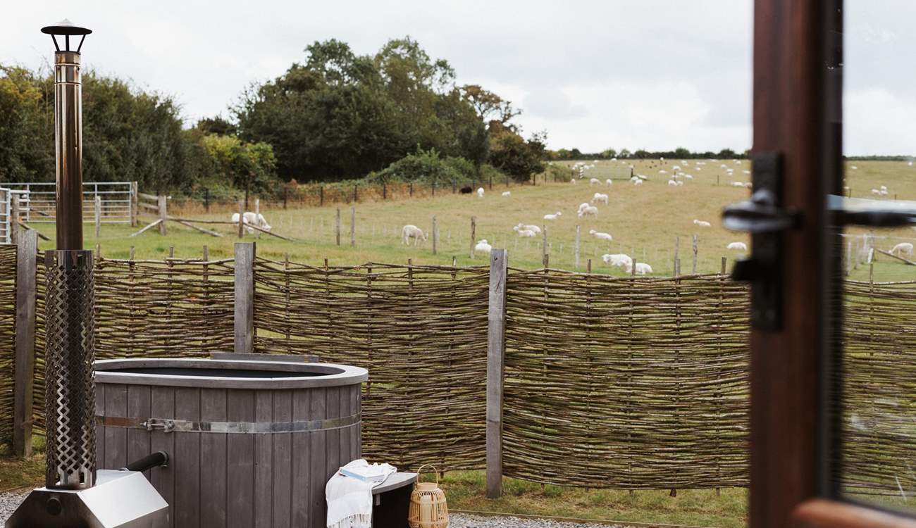 Sink into the heavenly hot tub and say hello to your neighbours who graze quietly in the surrounding fields. 