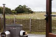 Sink into the heavenly hot tub and say hello to your neighbours who graze quietly in the surrounding fields.