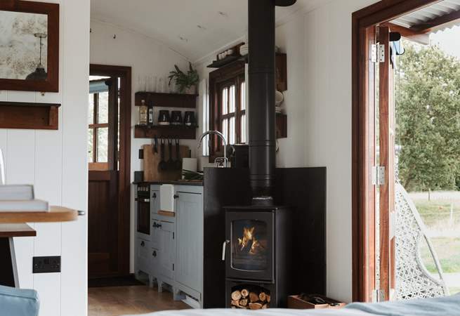 To the right is the well-equipped kitchen. 