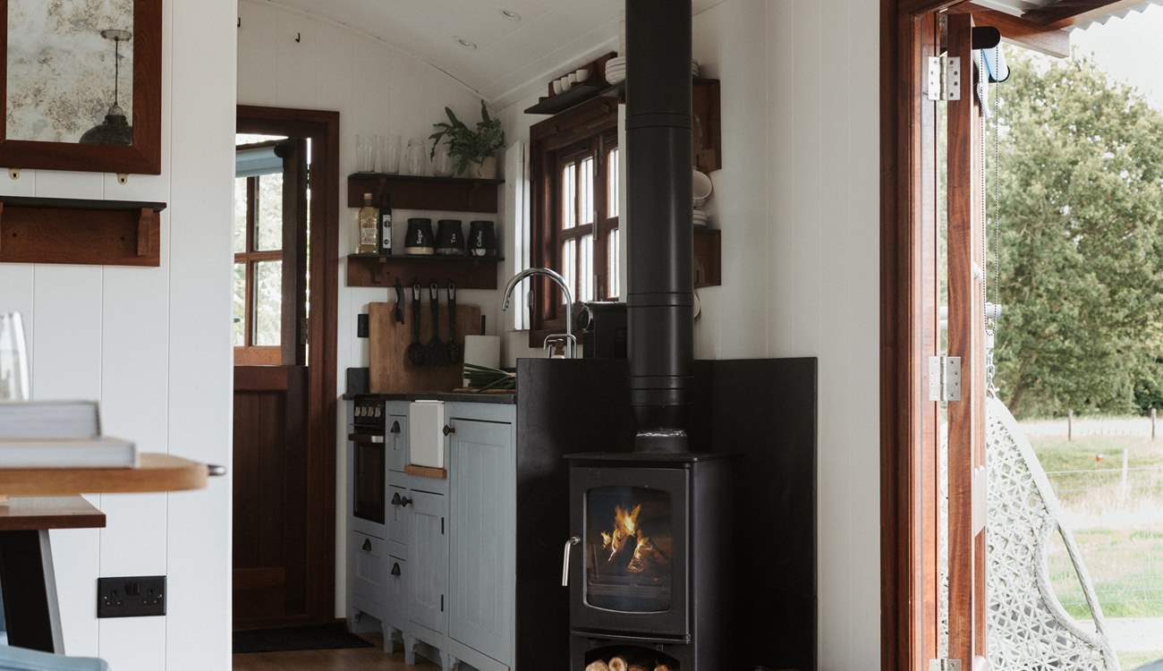 To the right is the well-equipped kitchen. 