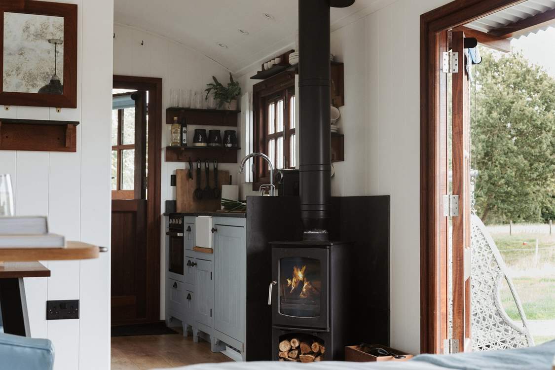 To the right is the well-equipped kitchen.