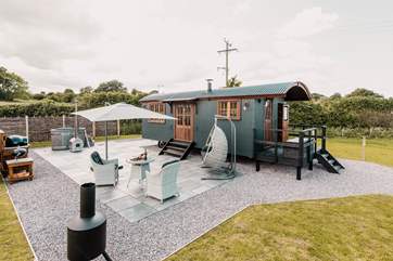 You will never want to leave your gorgeous patio with hot tub and egg chair to relax in.