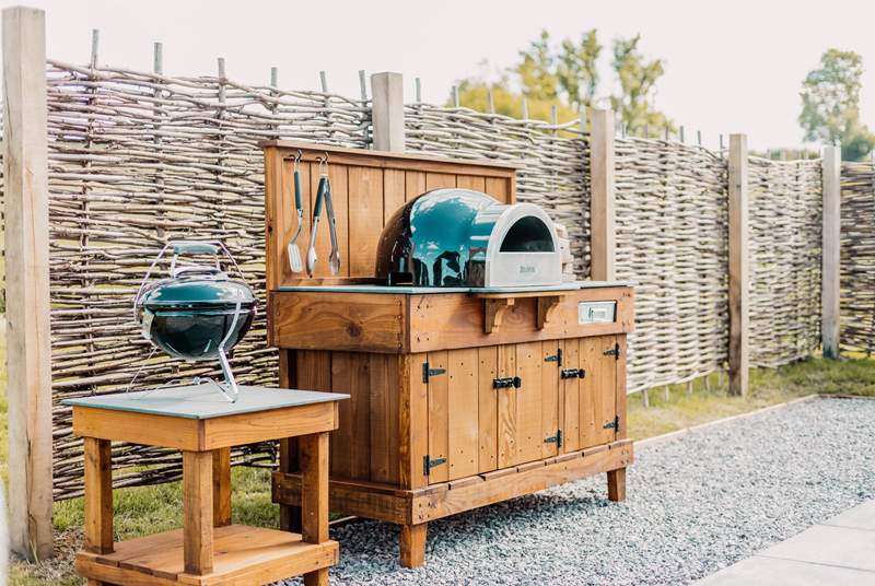 The barbecue and wood-fired pizza oven are ready and waiting.