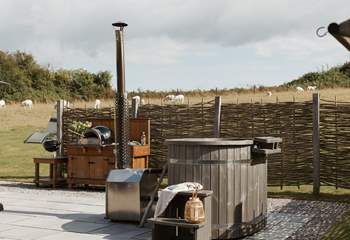 And the outside space is truly idyllic with a wood-fired hot tub and pizza oven. 