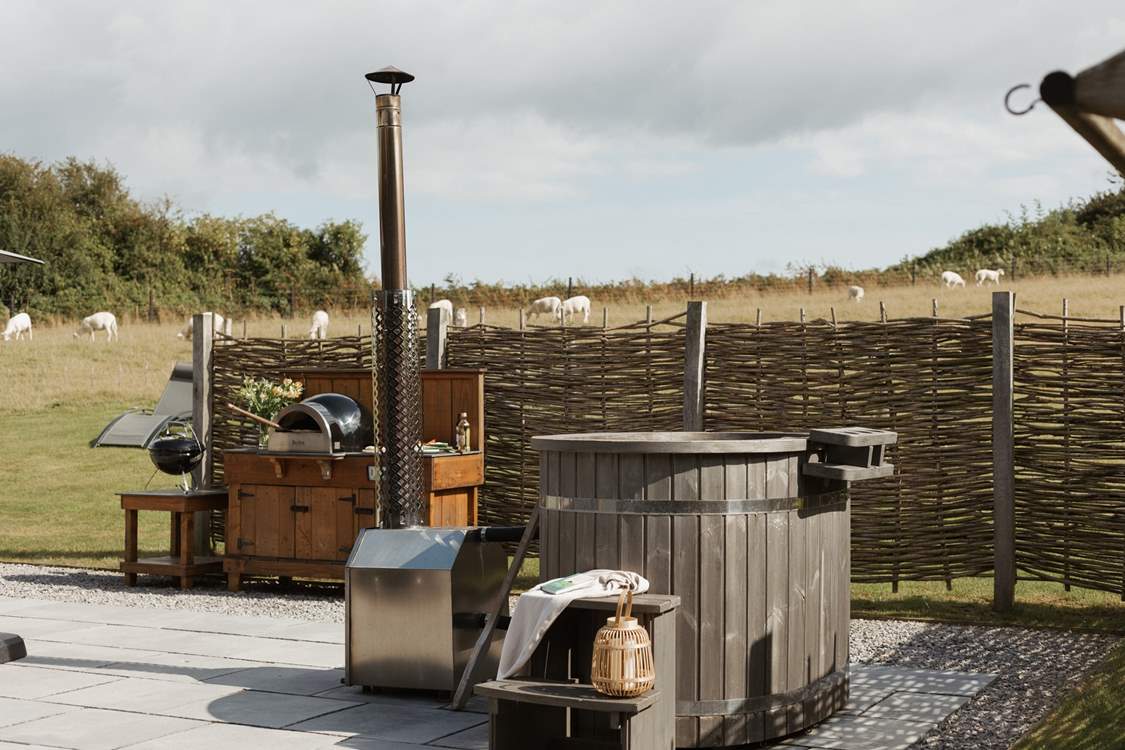 And the outside space is truly idyllic with a wood-fired hot tub and pizza oven.