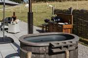 Sink into the steamy tub and say hello to your fluffy neighbours.