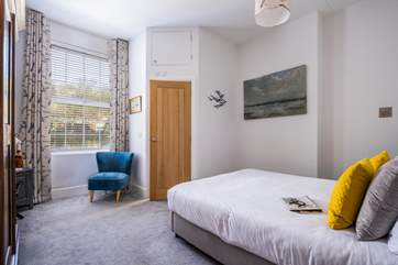 The spacious bedroom with a comfortable king-size double bed.