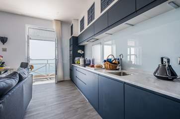 The kitchen is a cook's dream with deluxe integrated appliances and a Dolce Gusto coffee machine.
