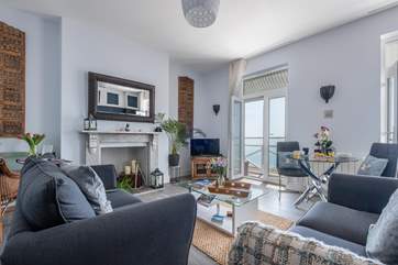 The open plan living area offers a great space to relax, dine and enjoy the stunning sea views.