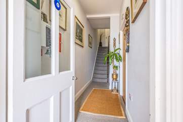 A communal hallway with stairs leading to the first floor to the Middle Deck.
