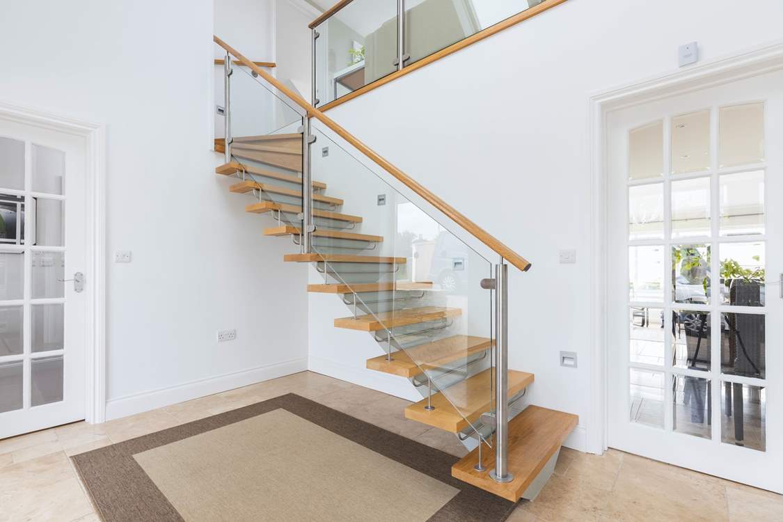 The beautifully designed staircase leads to the first floor.