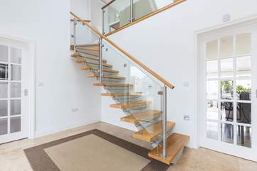 The beautifully designed staircase leads to the first floor.