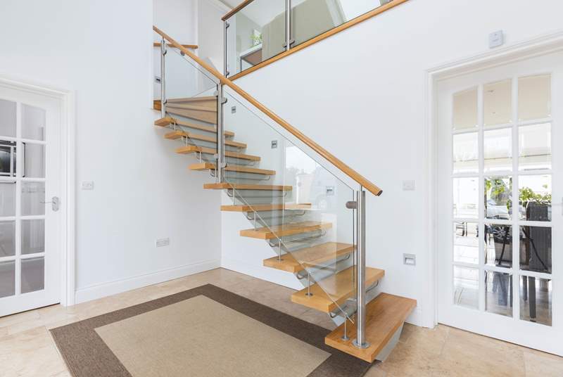 The beautifully designed staircase leads to the first floor.