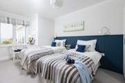 Bedroom 3 is a twin bedroom with dreamy views.
