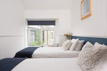 Pretty bedroom four has twin beds and is located on the first floor.