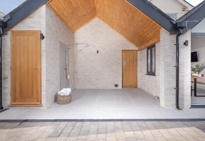 Wow! What a stunning space. The outside hot shower is huge! There is also a cloakroom (with WC and basin) located behind the oak door. 