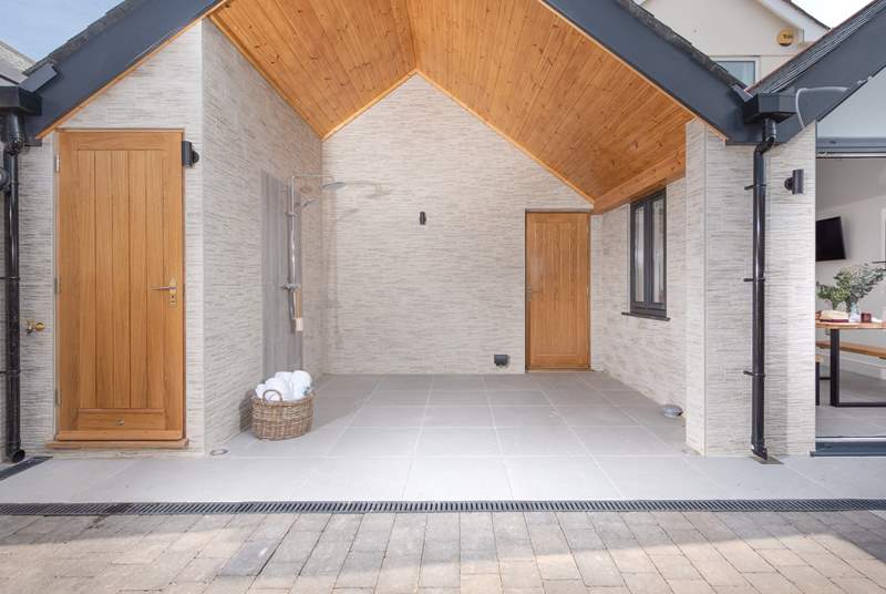 Wow! What a stunning space. The outside hot shower is huge! There is also a cloakroom (with WC and basin) located behind the oak door. 