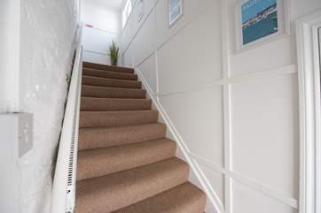 The stairs leading up from the ground floor.