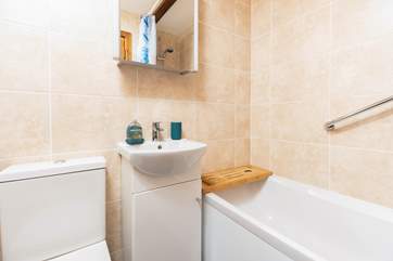 The family bathroom has a bath with shower attachment.