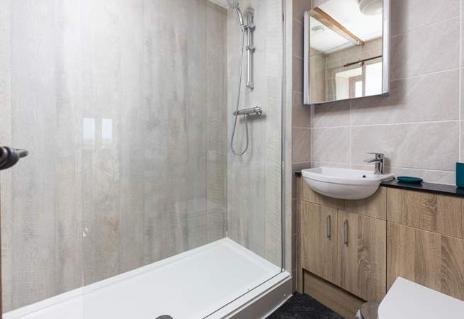 The en suite shower-room to bedroom 2, ideal to rinse salty toes after a beach day.