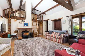 The sitting-room has a Smart TV, perfect for a movie night after a busy beach day.