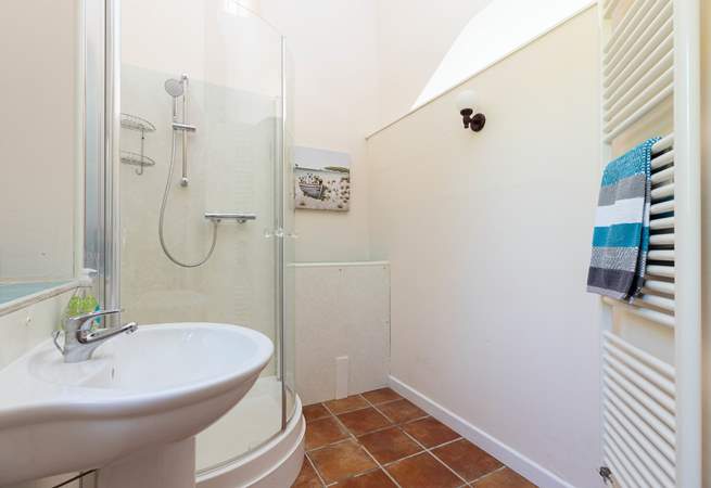The convenient en suite shower-room for bedroom 1 has a shower and wash-basin but please note there is no WC.