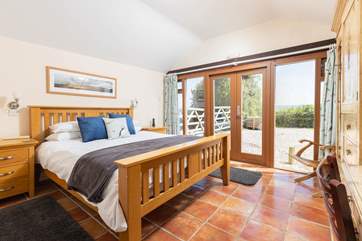 Dreamy bedroom 1 has a king-size bed and an en suite shower-room with a shower and wash-basin.
