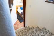 Steps lead down from the ground floor to bedroom 1 on the lower ground floor.