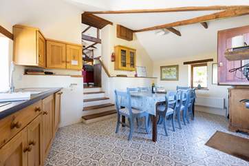 Down a short flight of steps, the kitchen/diner awaits.