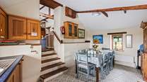 Down a short flight of steps, the kitchen/diner awaits.