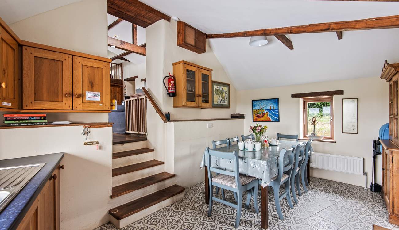 Down a short flight of steps, the kitchen/diner awaits.