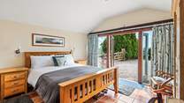 Dreamy bedroom 1 has a king-size bed and an en suite shower-room with a shower and wash-basin.