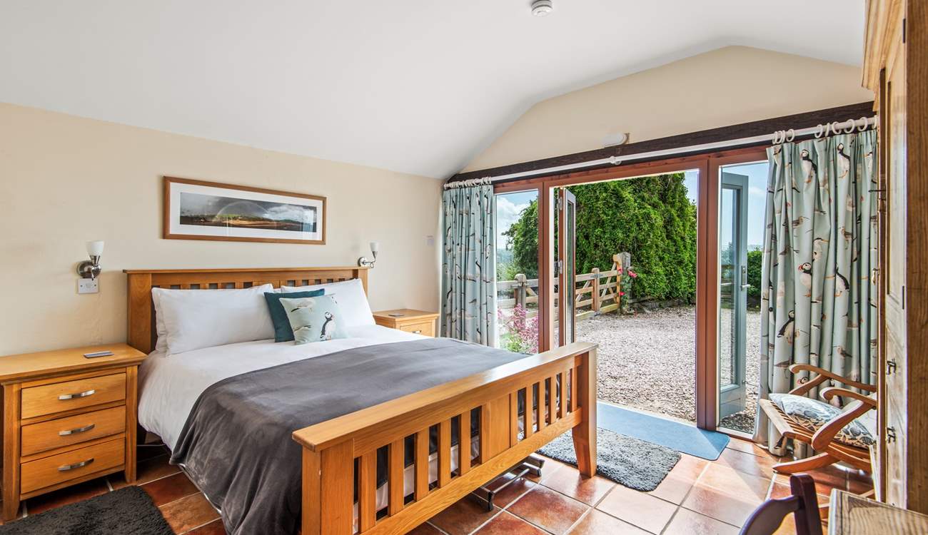 Dreamy bedroom 1 has a king-size bed and an en suite shower-room with a shower and wash-basin.