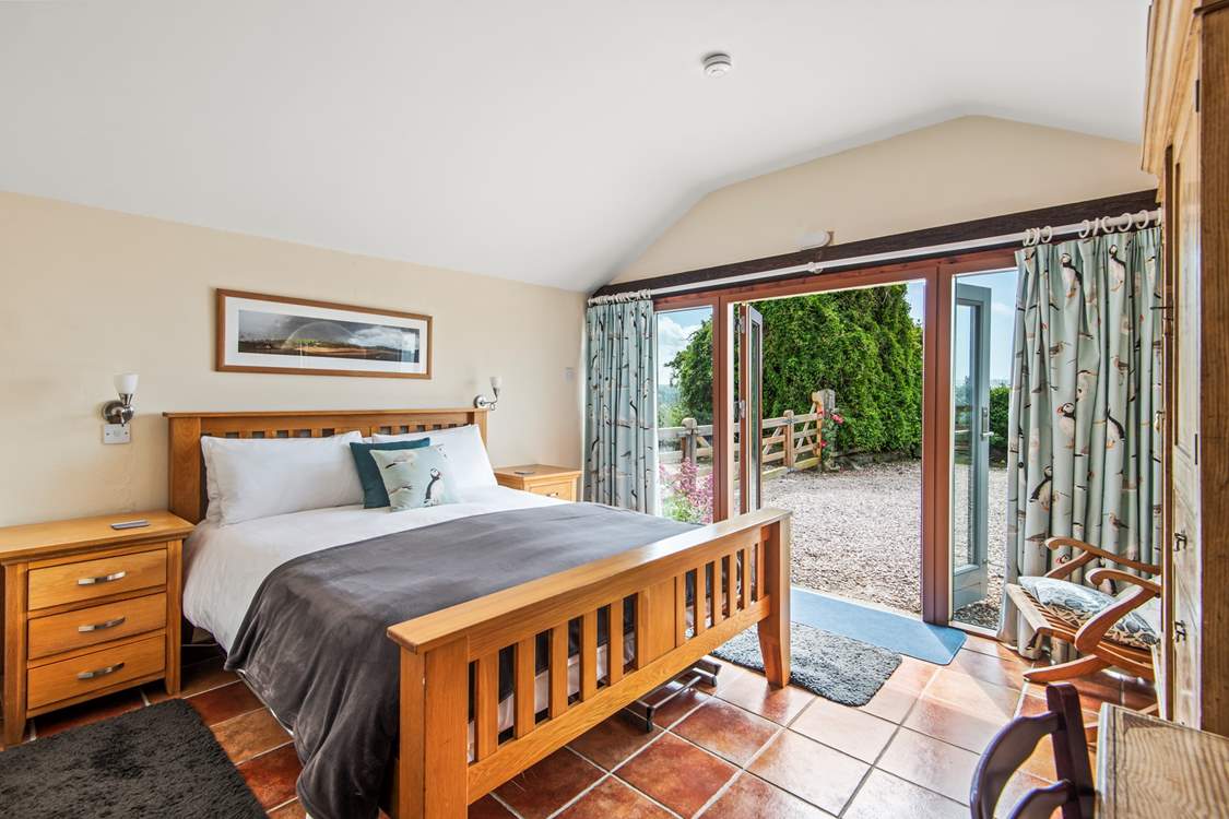 Dreamy bedroom 1 has a king-size bed and an en suite shower-room with a shower and wash-basin.