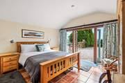 Dreamy bedroom 1 has a king-size bed and an en suite shower-room with a shower and wash-basin.