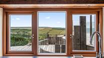Washing up will be very distracting here with this view! Luckily there is an all-important dishwasher.
