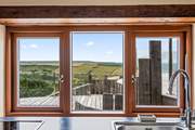 Washing up will be very distracting here with this view! Luckily there is an all-important dishwasher.