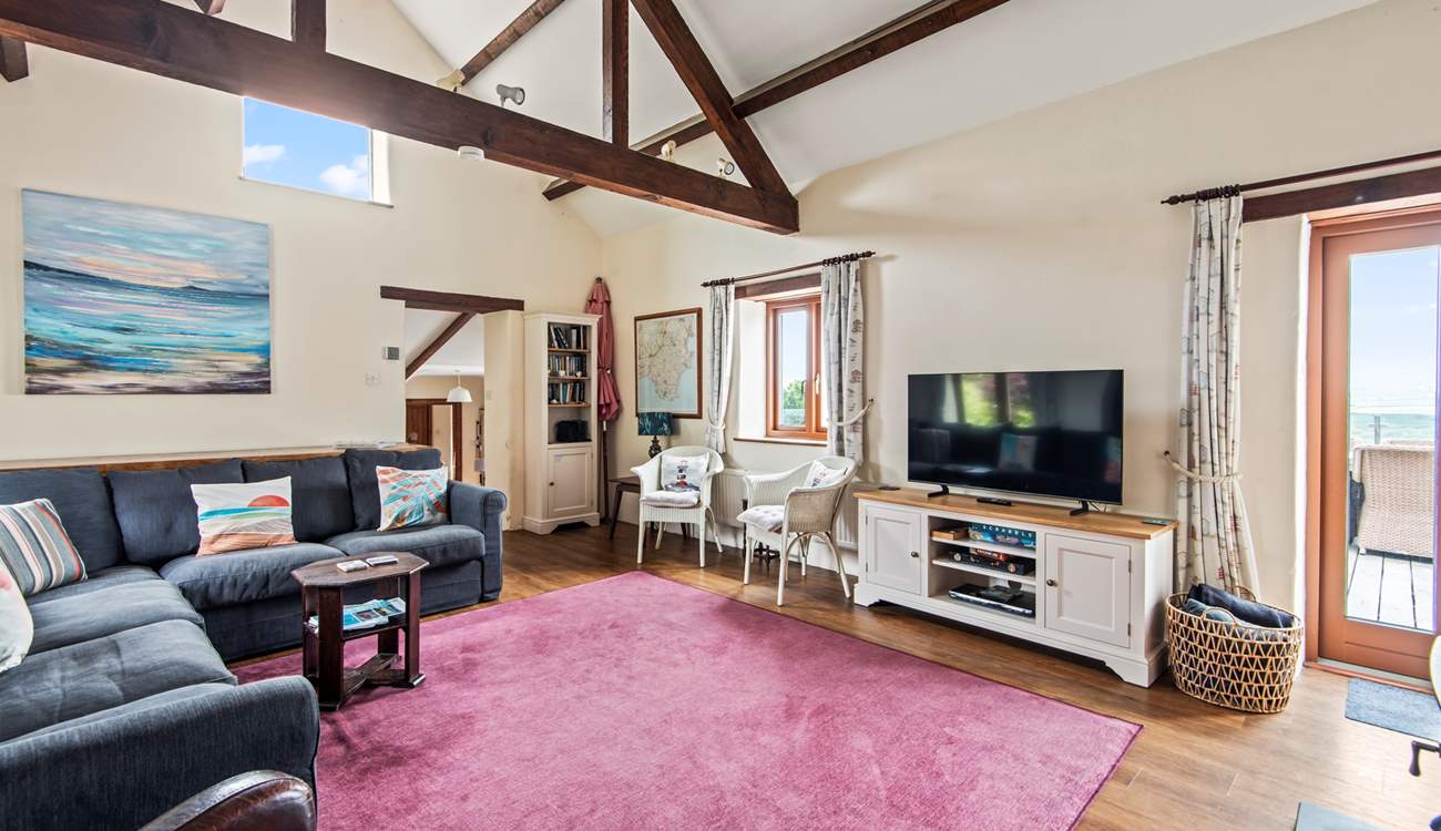 The sitting-room has a Smart TV, perfect for a movie night after a busy beach day.